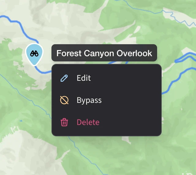 A waypoint on the map with a binoculars marker. A header pill above the action menu shows the waypoint's name — Forest Canyon Overlook — followed by Edit, Bypass, and Delete actions.